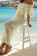 Robe bohème bodycon raffinée en crochet, avec épaules dénudées, qui sublime la silhouette tout en apportant une touche chic et sensuelle parfaitement maîtrisée