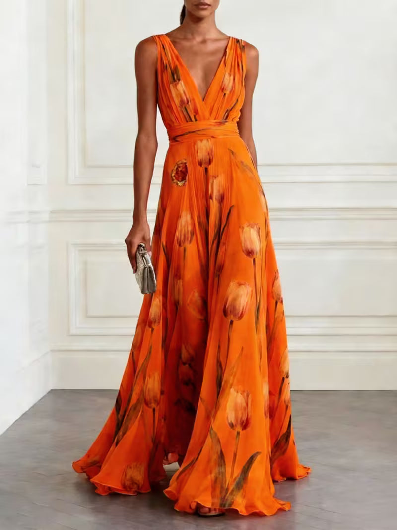 Robe de cocktail longue vaporeuse à imprimé tulipes, légère et élégante, qui sublime la silhouette avec une touche florale chic et une allure fluide irrésistiblement romantique