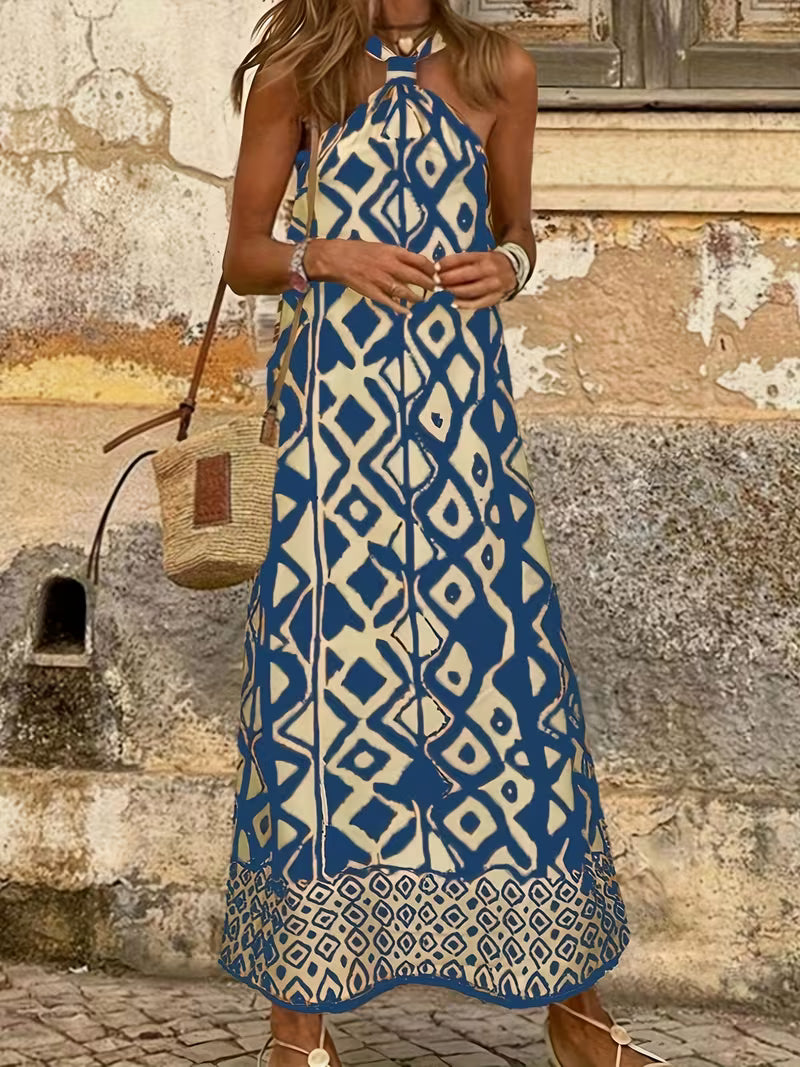 Robe longue raffinée à imprimé géométrique avec col halter, élégante et moderne, qui sublime la silhouette avec un style chic et résolument tendance