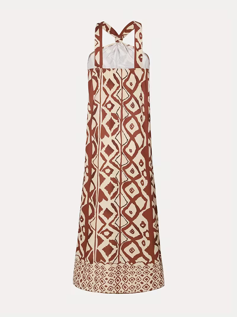 Robe longue raffinée à imprimé géométrique avec col halter, élégante et moderne, qui sublime la silhouette avec un style chic et résolument tendance